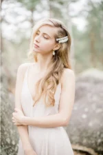 - Hair clip adorned with stabilized white flowers and small pearls